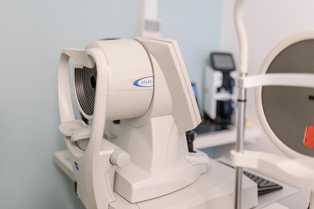 White Atlas medical imaging device in a clinical room, ready for use by a technician.